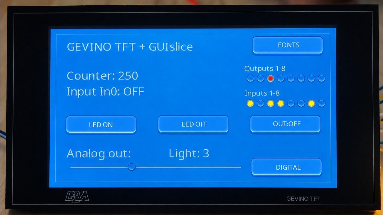 The real GEVINO TFT running its blue GUIslice demonstration screen
