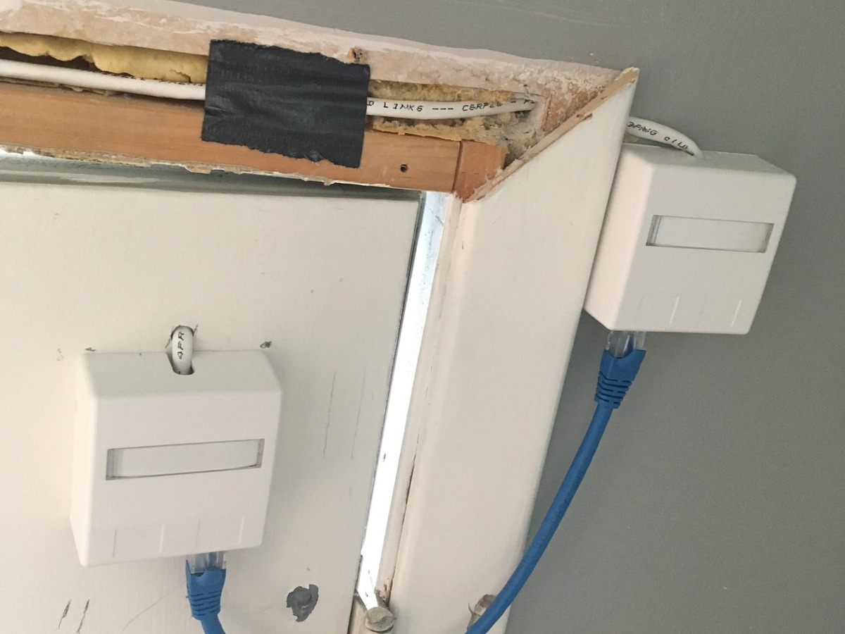 PoE adapter and wiring route near the door frame