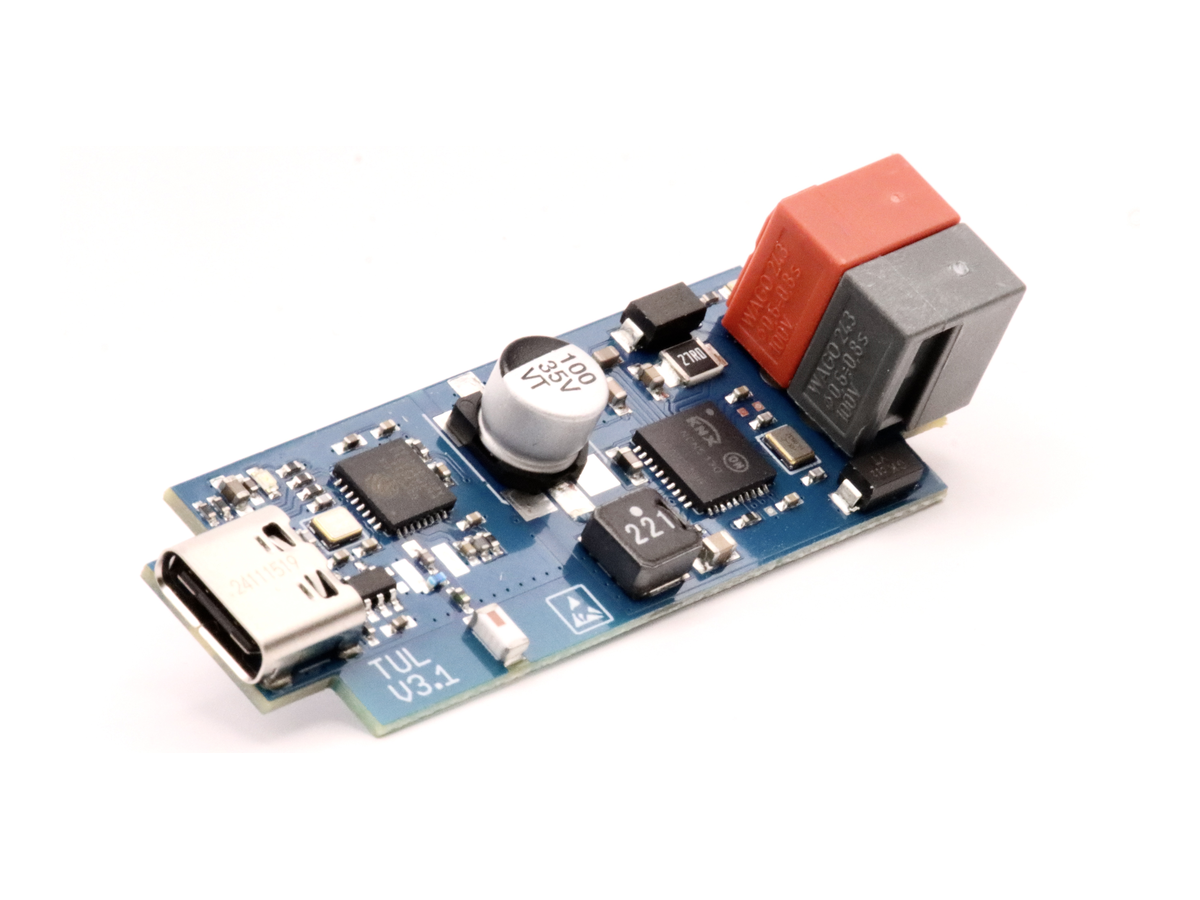 Photo of the busware TUL V3.1 board, a small blue PCB with a USB-C connector at one end and red and grey WAGO screwless terminals for the KNX bus at the other